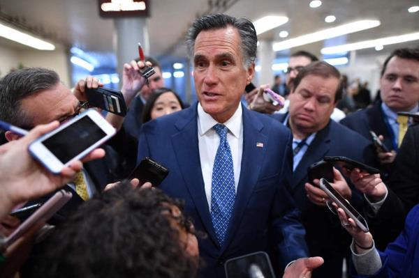 Sen. Mitt Romney is pictured speaking to the media as he arrived for the impeachment trial of former President Do<em></em>nald Trump.