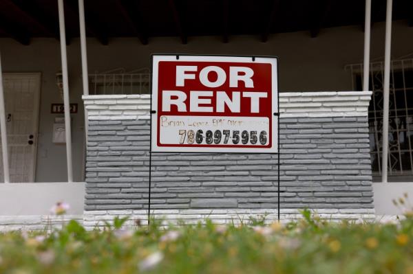 For rent sign on a stand in front of a house, Miami, Florida.