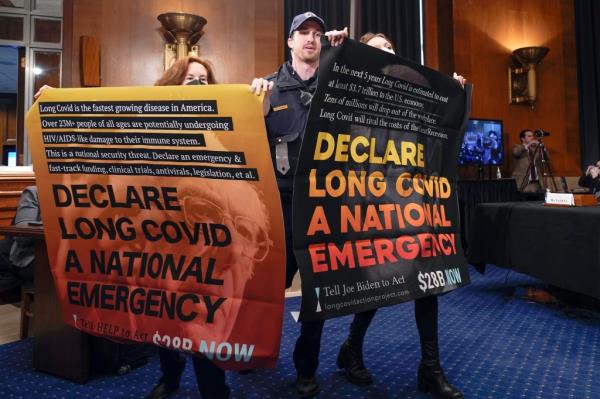 Long COVID occurs when people co<em></em>ntinue to report symptoms that last for mo<em></em>nths or even years. Above, protestors gather during a Senate Health, Education, Labor and Pensions hearing to examine long COVID on Capitol Hill in Washington last month. 