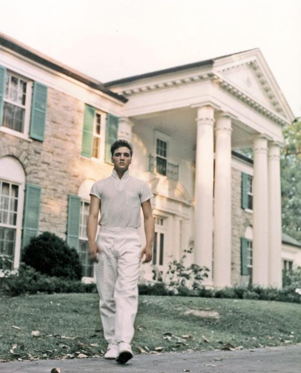 Elvis Presley walking around his Graceland estate in Memphis, 1957