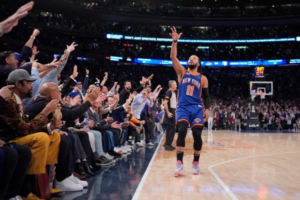 New York Knicks' Jalen Brunson (11) gestures to fans after making a three-point shot during the second half of Game 5 in an NBA basketball second-round playoff series against the Indiana Pacers,