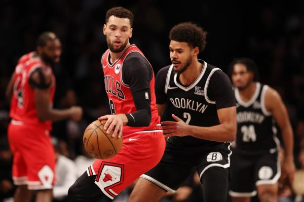 Cam Johnson plays tight defense on Zach LaVine during the Nets' win over the Bulls.