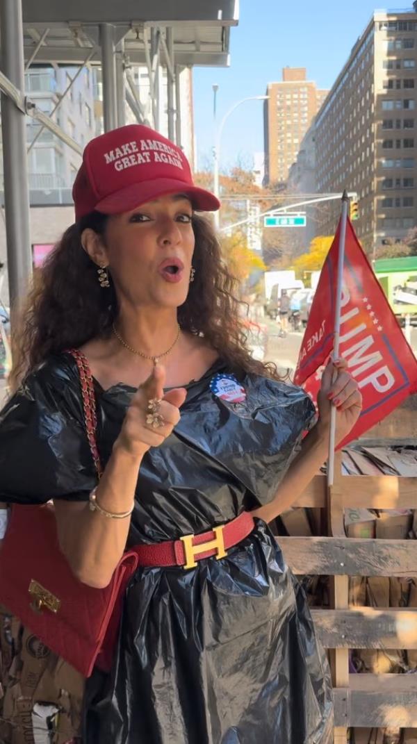 Sophie Sassoon posing in a MAGA hat and a trash bag outfit